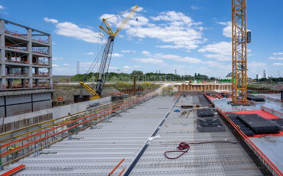 Construction site with steel decking and tower cranes