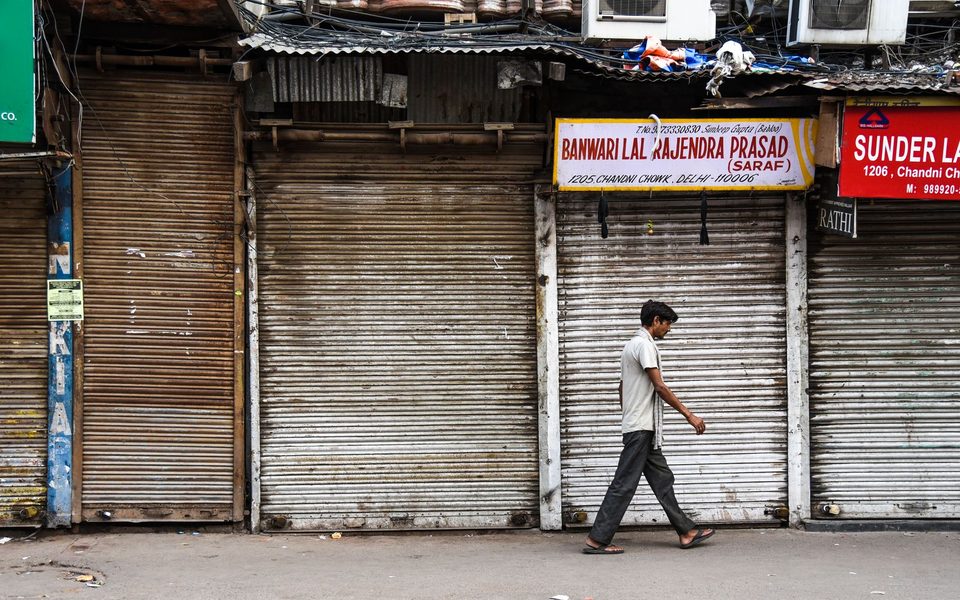 Market street of shops with shutters down after closing