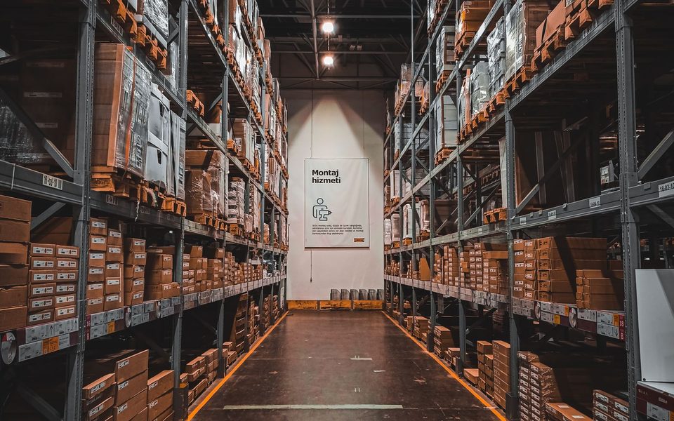 Warehouse aisle with racking stacked to the roof